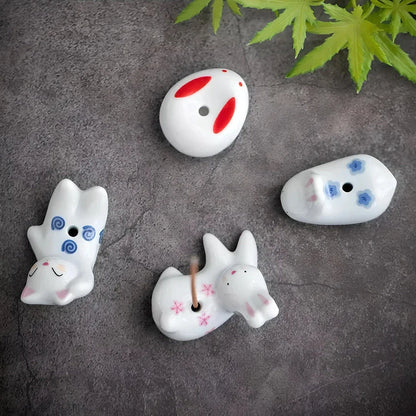 Charming ceramic incense holder featuring a cute rabbit and kitten design, perfect for adding a touch of whimsy and tranquility to any room.