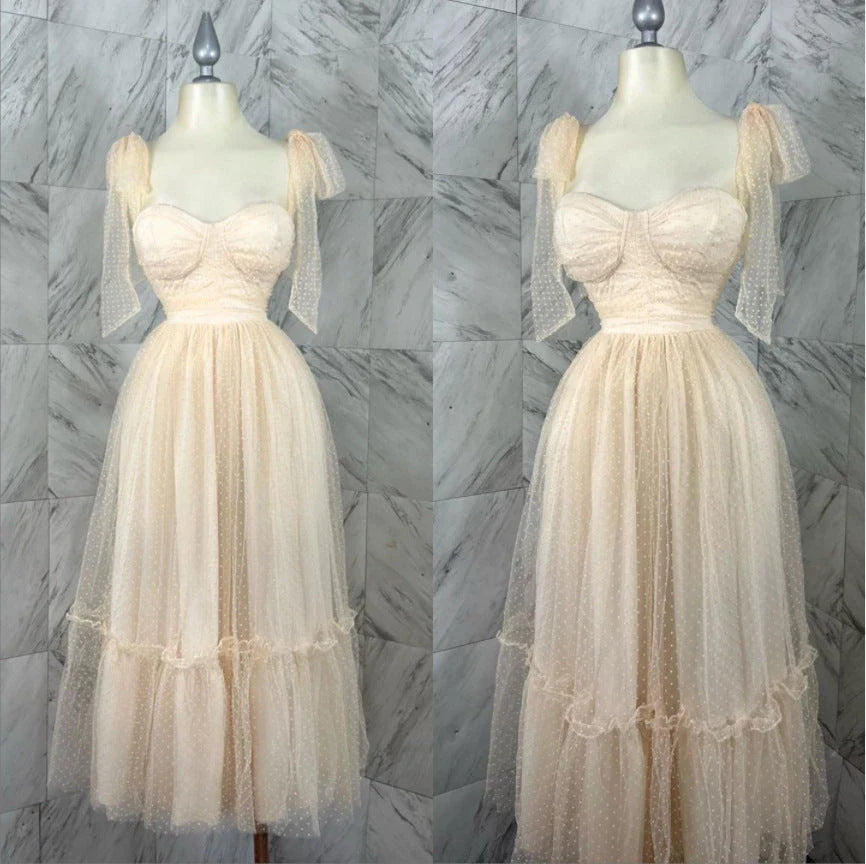 Fairy-inspired dress with mid-length silhouette, lace-up details, and luxurious polyester fabric