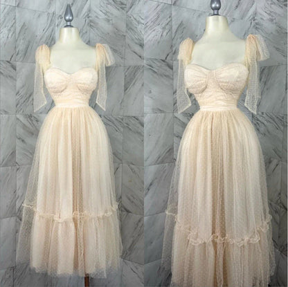 Fairy-inspired dress with mid-length silhouette, lace-up details, and luxurious polyester fabric