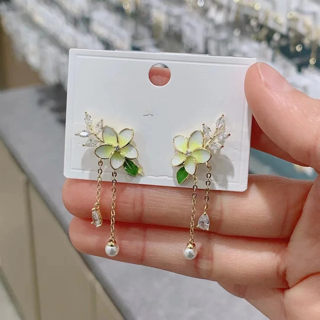 Elegant floral zircon and pearl tassel earrings in gold and silver tones