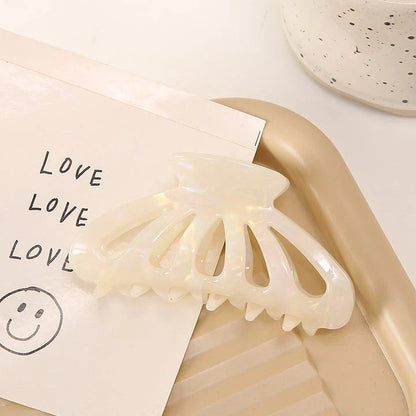 Stylish geometric hollow stripes barrettes in beige color, a fashionable hair accessory for women and girls