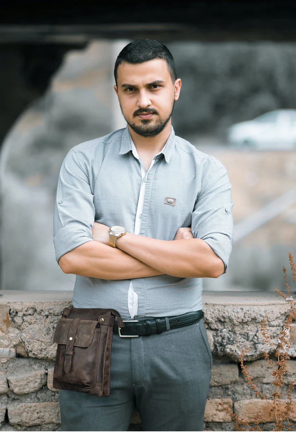 A premium cowhide leather shoulder bag with a compact and versatile design, suitable for various occasions and outdoor activities.