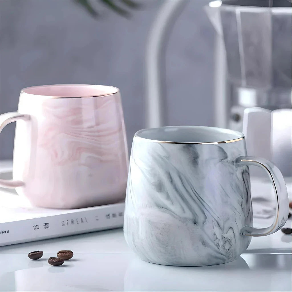 Elegant marble pattern ceramic mug with a gold rim, perfect for coffee, tea, and other hot and cold beverages
