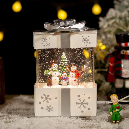 A festive red gift box with a crystal ball night lamp that emits warm, soothing lighting and plays classic Christmas songs.