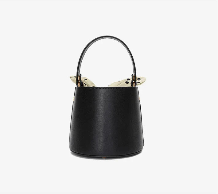 Premium leather bucket bag tote with bow-type closure, exquisite golden hardware, and versatile design