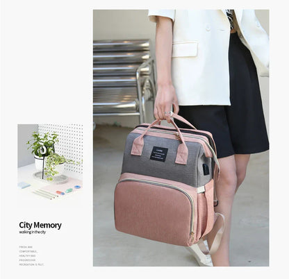 Multifunctional maternity diaper backpack with detachable crib, large capacity, and water-resistant design for travel