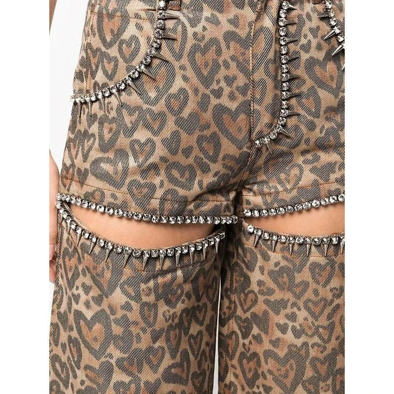 Chic high-waisted patchwork leopard print denim trousers with rivet details and wide-leg silhouette