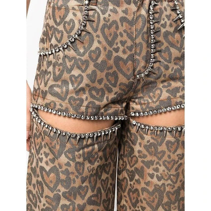 Chic high-waisted patchwork leopard print denim trousers with rivet details and wide-leg silhouette