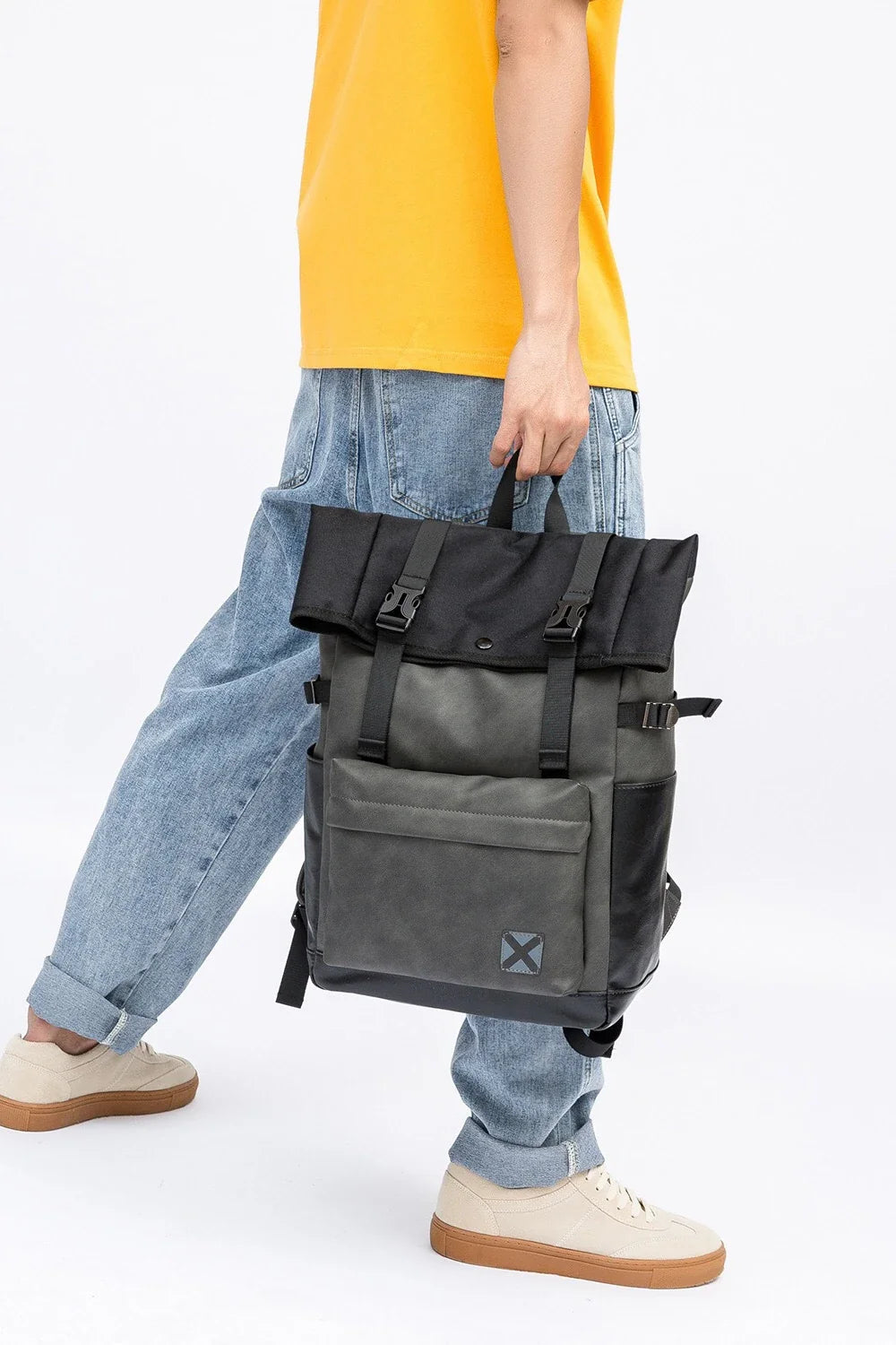 A large, high-quality PU leather backpack with a sleek, modern design and ample storage capacity