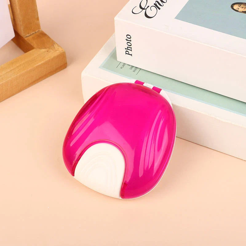 Compact, transparent dental retainer storage box with a push-to-open mechanism for easy access to dental appliances