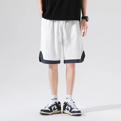 Men's loose and comfortable sports pirate shorts in white, gray, and black colors with elasticized waistband and relaxed fit