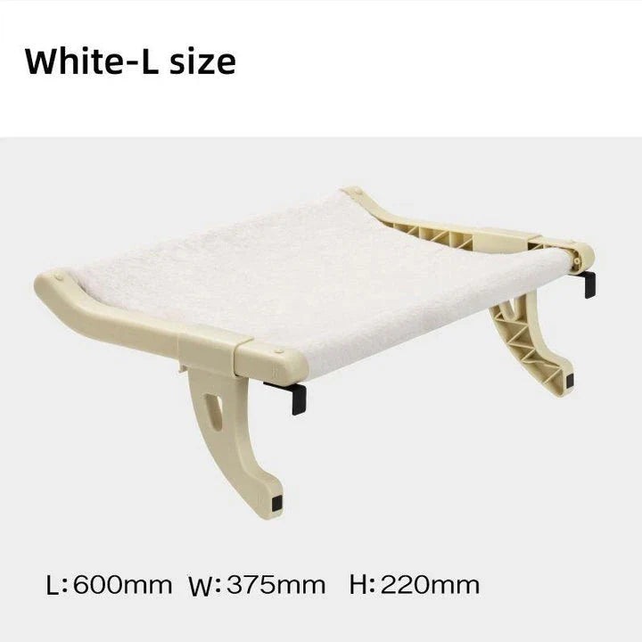 Cat relaxing in a cozy, hanging hammock bed placed in a sunny window