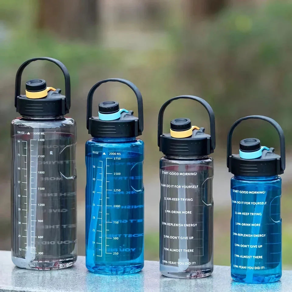 A large capacity sports water bottle with a straw lid and time stamps, designed for ultimate hydration and convenience.