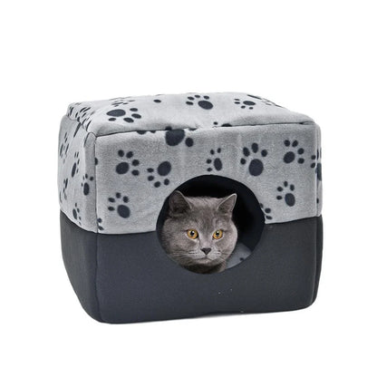 A plush, white pet bed with a stylish paw print design, providing a cozy and comfortable resting space for dogs or cats.