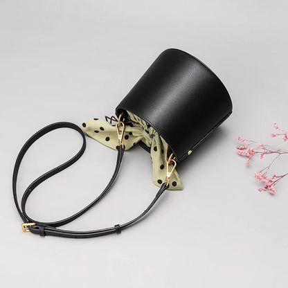 Premium leather bucket bag tote with bow-type closure, exquisite golden hardware, and versatile design