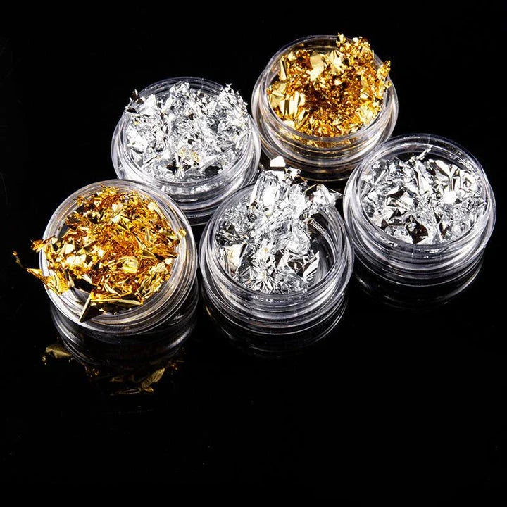 Dazzling gold and silver glitter foil nail art set with 12 vibrant pots for creating stunning, sparkly nail designs