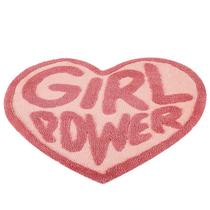 Cozy pink heart-shaped tufted rug with 'GRL PWR' message, perfect for girls' rooms, dressing rooms, and bathrooms