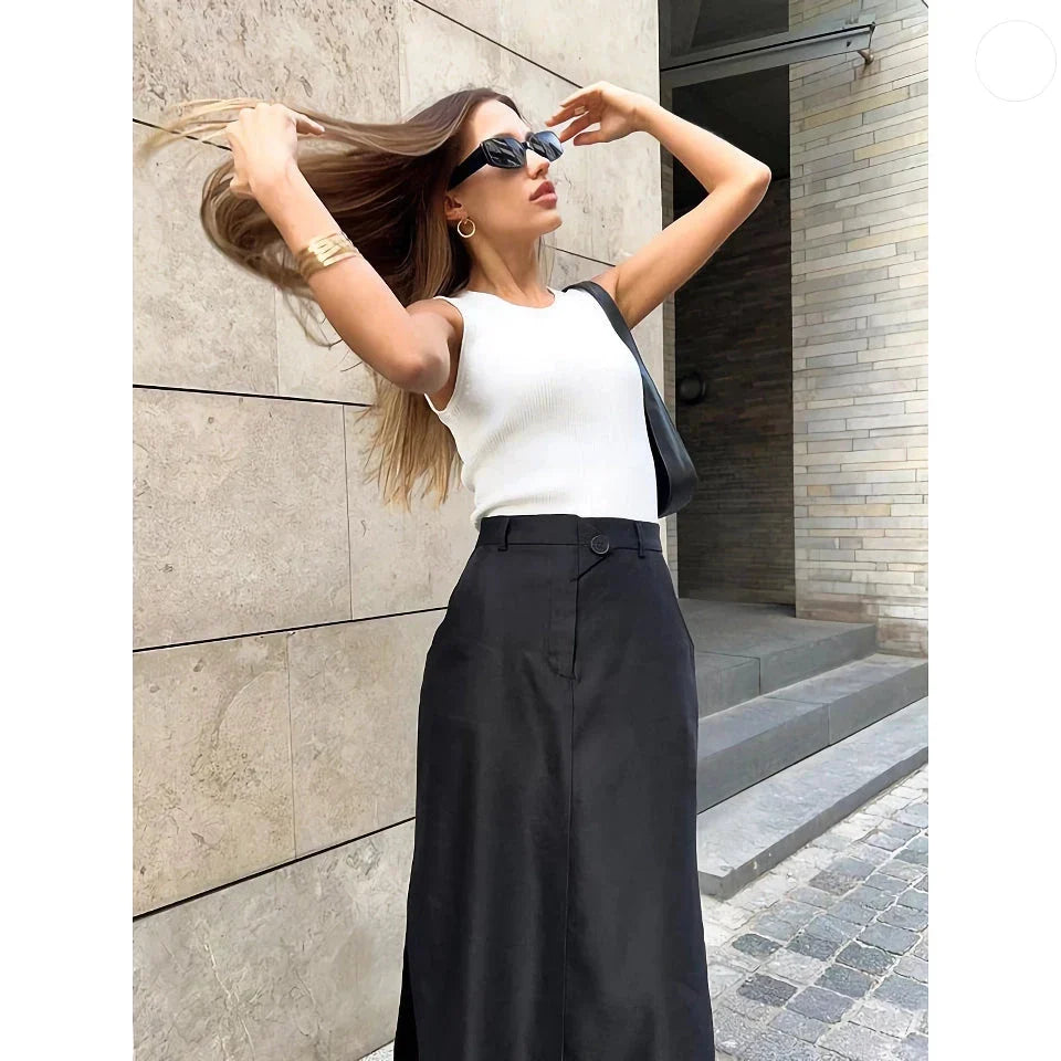 Elegant black ankle-length A-line skirt with functional pockets, made from a premium polyester blend fabric.