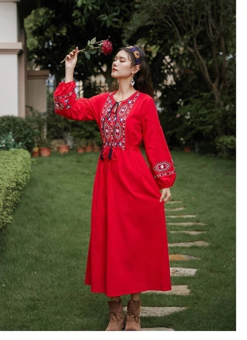 Elegant embroidered cotton-linen dress with tassels, featuring a waist-cinching A-line silhouette in vibrant colors