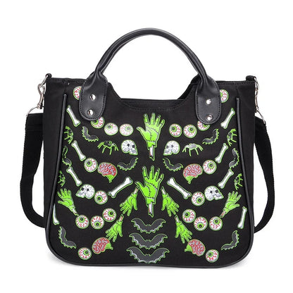 Chic spooky ghost print canvas tote bag with adjustable shoulder strap and zippered closure
