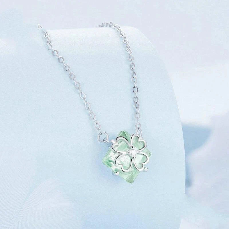 Elegant platinum-plated adjustable green pendant necklace with a sleek, silver-toned chain and a stylish green pendant