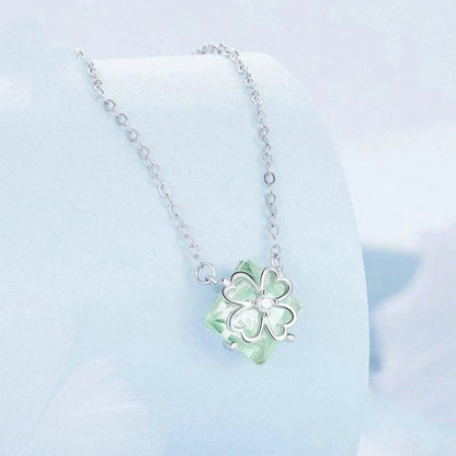 Elegant platinum-plated adjustable green pendant necklace with a sleek, silver-toned chain and a stylish green pendant