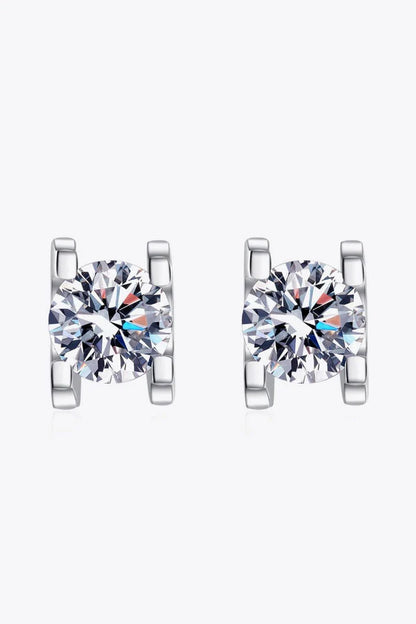 A pair of 1 carat moissanite stud earrings made of 925 sterling silver with a rhodium plating for a dazzling shine.
