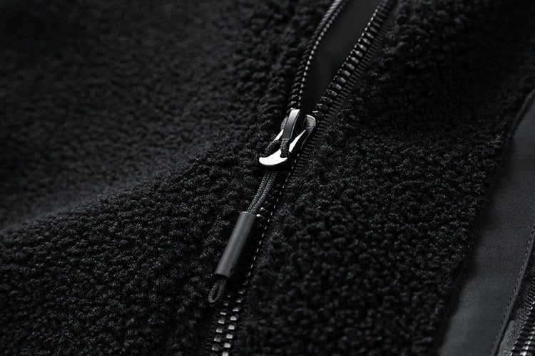 A cozy and stylish men's fleece jacket with a standing collar and convenient side pockets, available in a range of classic colors.