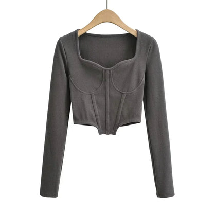 A stylish slim-fit short autumn top with an open waist design, made of premium polyester fabric with long sleeves and a square collar.