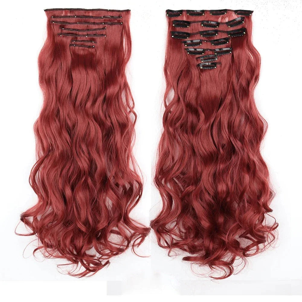 Model wearing long, wavy ombre clip-in hair extensions that blend seamlessly with her natural hair