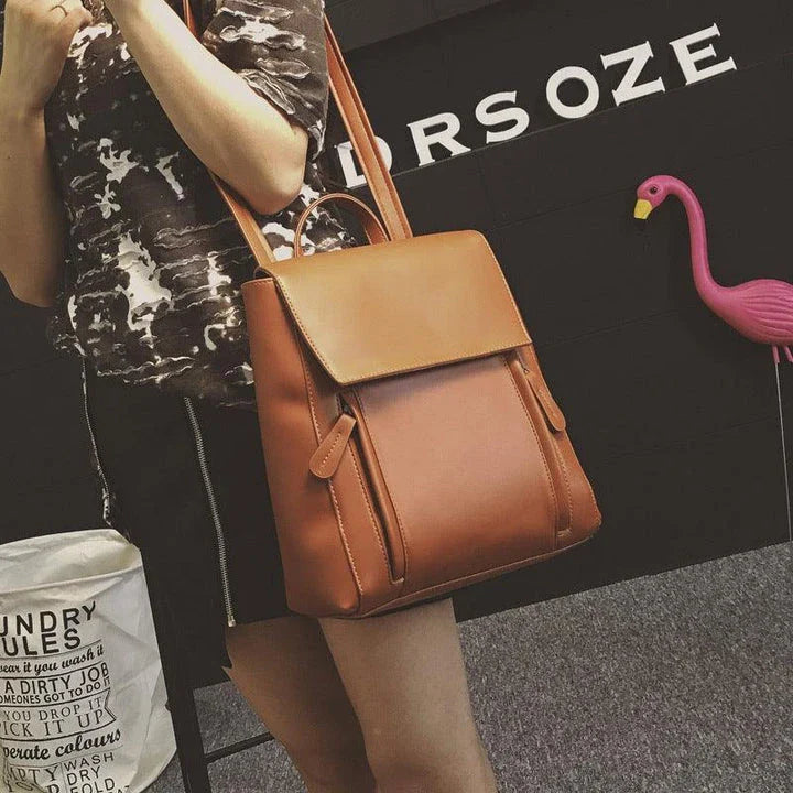 Versatile British-inspired shoulder bag made from high-quality PU leather with a spacious main compartment, convenient pockets, and an adjustable strap