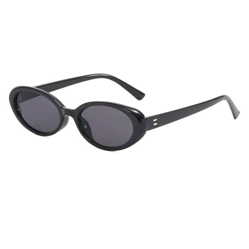 Chic oval sunglasses with white grey acetate frames and polycarbonate lenses, designed for fashionable women to shield their eyes from UV rays in style.
