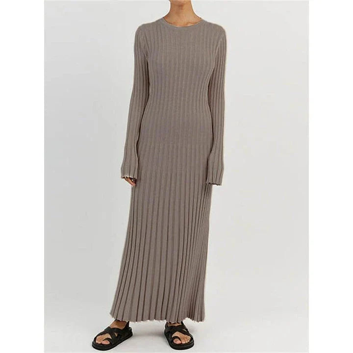 Timeless elegant pleated knit dress in black, perfect for summer office wear with a sophisticated and comfortable design.