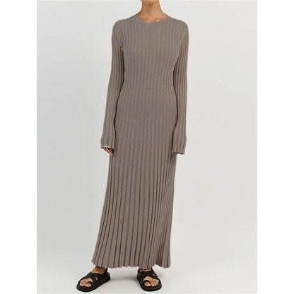 Timeless elegant pleated knit dress in black, perfect for summer office wear with a sophisticated and comfortable design.
