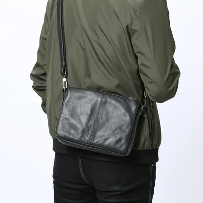 Premium cowhide leather crossbody bag with multiple interior pockets for organized, hands-free carrying