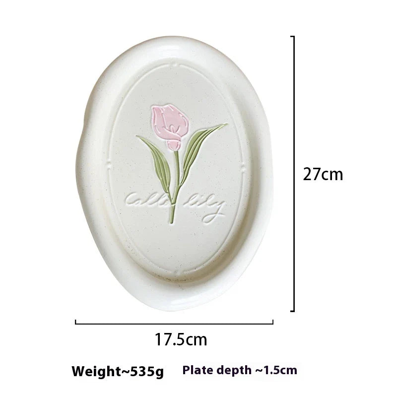 Elegant ceramic plate featuring a delicate floral relief design of Calla Lily and Tulip flowers, perfect for refined dining