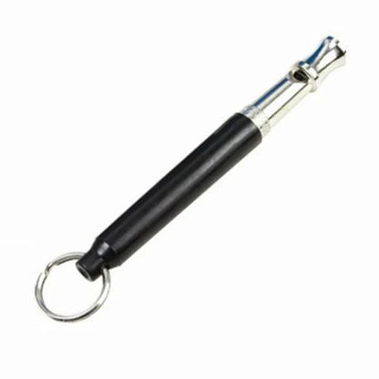 Compact dog training whistle made of metal and plastic with a black and silver design