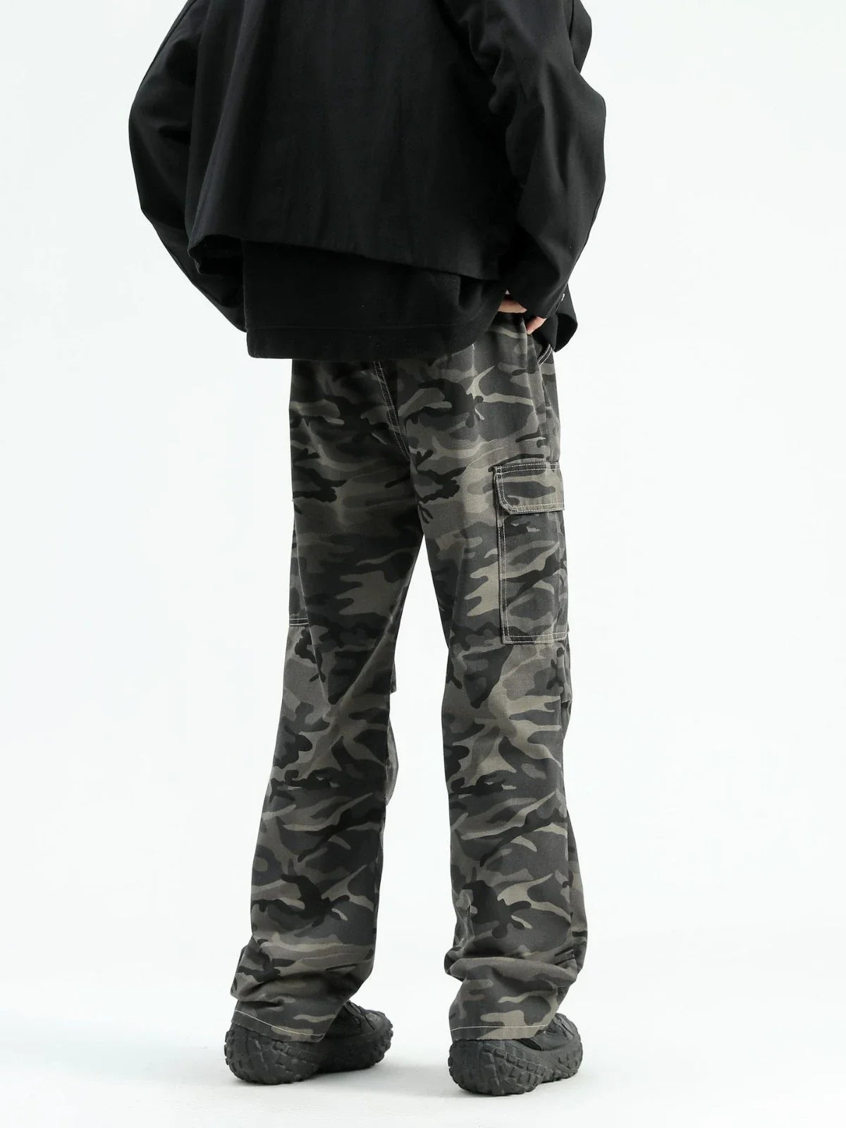 Stylish paratrooper denim trousers with a mid-waist silhouette and straight leg cut, featuring a camouflage pattern and premium cotton construction for rugged, versatile wear.