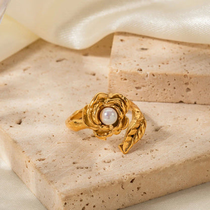 Gold stainless steel camellia ring with shellfish beads, a timeless and elegant accessory for any occasion.