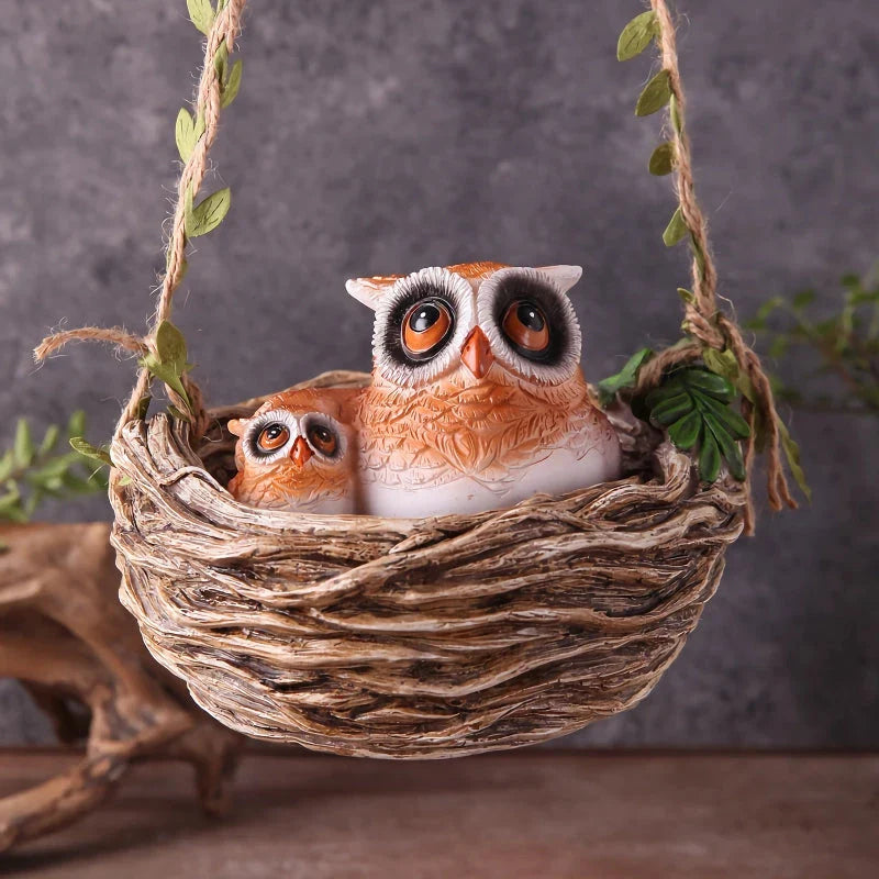 High-quality resin sculpture of a mother owl and her baby nestled in a cozy nest, perfect for adding natural charm to home and garden decor