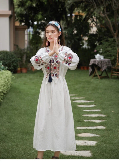 Elegant embroidered cotton-linen dress with tassels, featuring a waist-cinching A-line silhouette in vibrant colors