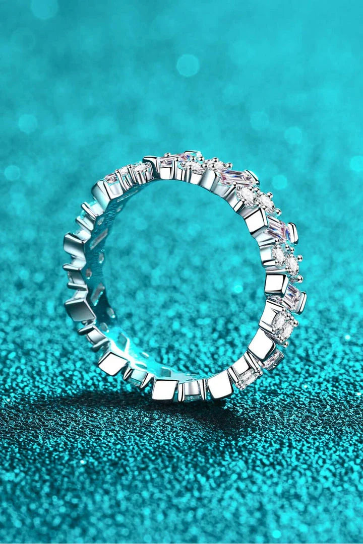 Elegant 925 sterling silver ring featuring a captivating 0.2-carat Moissanite center stone surrounded by a sparkling halo of Moissanite accent gems