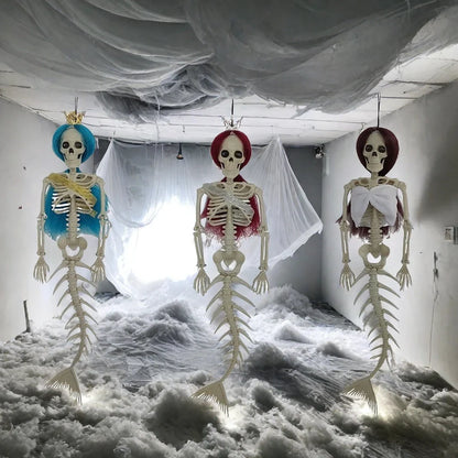 Mermaid bone pendant in various colors, including brown, dark purple, burgundy, and lake blue, hanging outdoors for Halloween decoration
