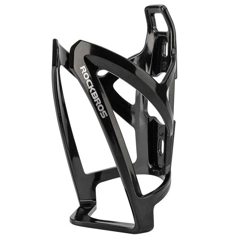 A stylish, lightweight cycling bottle holder with a two-tone design, securely holding a water bottle on a bike.