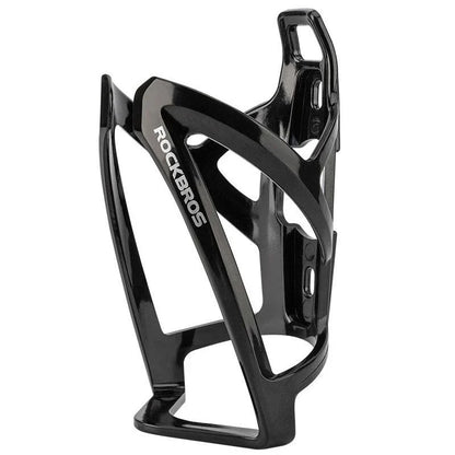 A stylish, lightweight cycling bottle holder with a two-tone design, securely holding a water bottle on a bike.