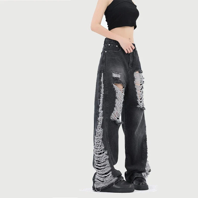 Premium loose fit distressed denim trousers for men and women, featuring a relaxed silhouette, high-quality cotton construction, and trendy distressed details.