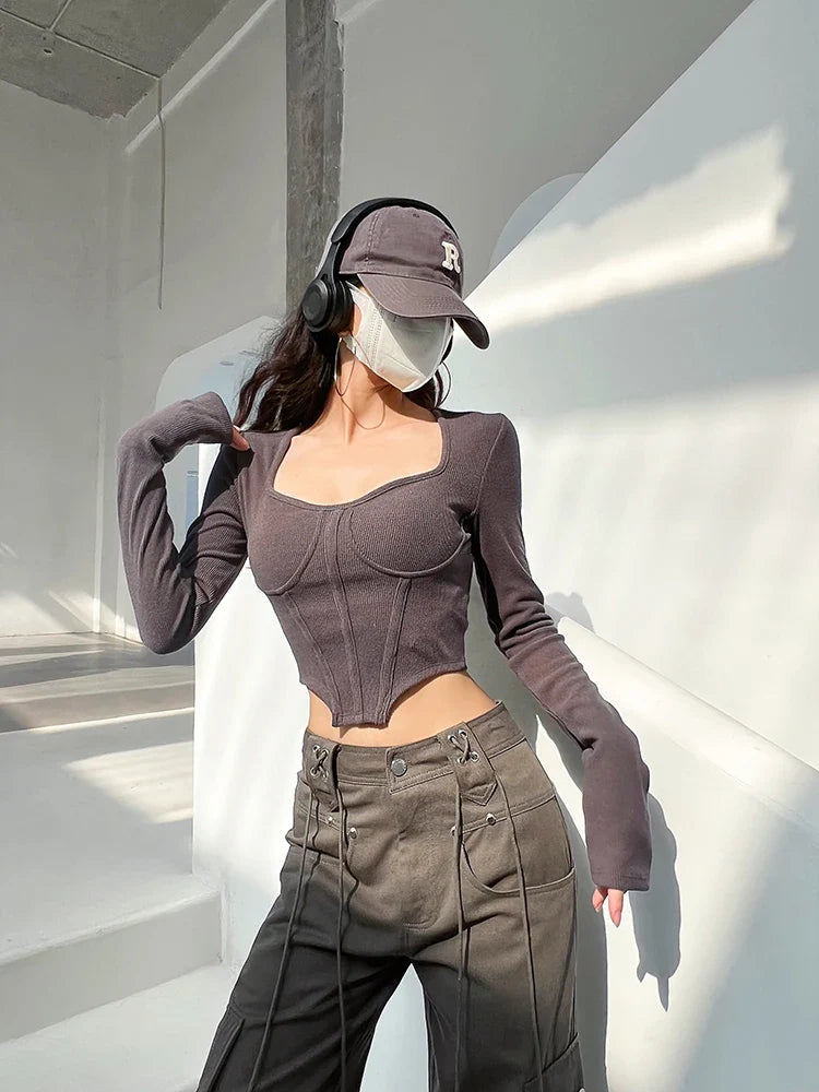 A stylish slim-fit short autumn top with an open waist design, made of premium polyester fabric with long sleeves and a square collar.