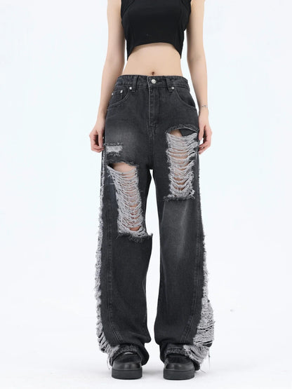 Premium loose fit distressed denim trousers for men and women, featuring a relaxed silhouette, high-quality cotton construction, and trendy distressed details.