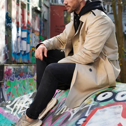 Stylish men's double-breasted trench coat in light gray color with slim fit silhouette