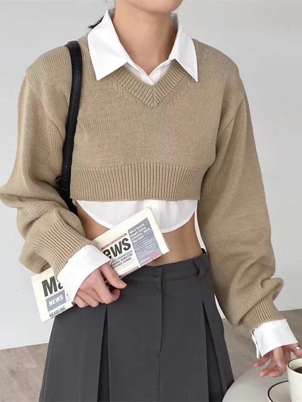 A cozy, knitted pullover sweater with a timeless round neck design, available in a versatile camel color.